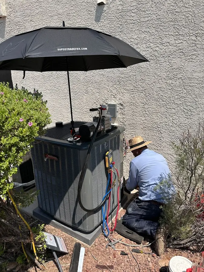 HVAC technician performing outdoor AC maintenance in Lower Pottsgrove